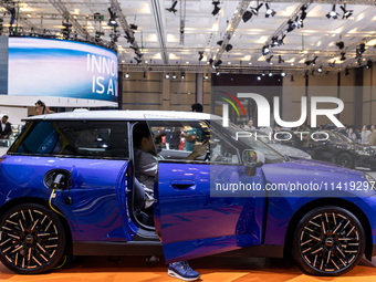 The new all-electric MINI Cooper is being showcased at the GAIKINDO Indonesia International Auto Show (GIIAS) in Tangerang, Indonesia, on Ju...