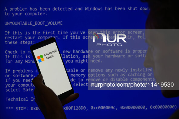 The Microsoft Azure is being displayed on a smartphone with a Windows blue screen visible in the background in this photo illustration in Br...