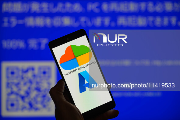 The Microsoft Azure is being displayed on a smartphone with a Windows blue screen visible in the background in this photo illustration in Br...