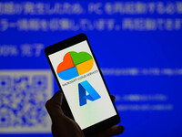 The Microsoft Azure is being displayed on a smartphone with a Windows blue screen visible in the background in this photo illustration in Br...