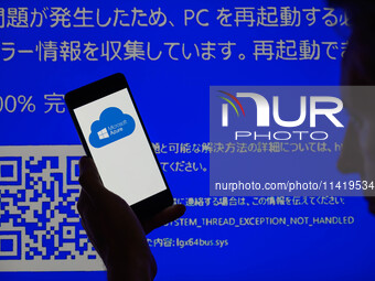 The Microsoft Azure is being displayed on a smartphone with a Windows blue screen visible in the background in this photo illustration in Br...