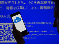 The Microsoft Azure is being displayed on a smartphone with a Windows blue screen visible in the background in this photo illustration in Br...