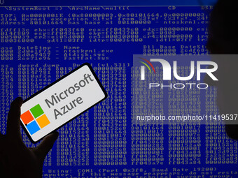 The Microsoft Azure is being displayed on a smartphone with a Windows blue screen visible in the background in this photo illustration in Br...