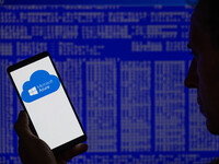 The Microsoft Azure is being displayed on a smartphone with a Windows blue screen visible in the background in this photo illustration in Br...