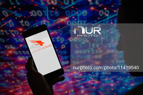 The CrowdStrike logo is being displayed on a smartphone in this photo illustration in Brussels, Belgium, on July 19, 2024. 