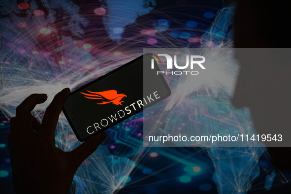 The CrowdStrike logo is being displayed on a smartphone in this photo illustration in Brussels, Belgium, on July 19, 2024. 