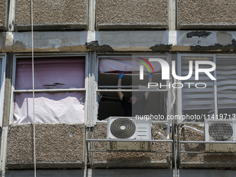 A view of a damaged building in the area of an explosion as Israeli policemen are searching the scene in Tel Aviv, Israel, on July 19, 2024....