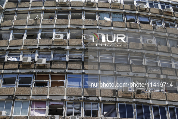 A view of a damaged building in the area of an explosion as Israeli policemen are searching the scene in Tel Aviv, Israel, on July 19, 2024....