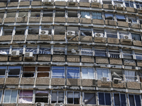 A view of a damaged building in the area of an explosion as Israeli policemen are searching the scene in Tel Aviv, Israel, on July 19, 2024....