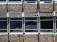 A view of a damaged building in the area of an explosion as Israeli policemen are searching the scene in Tel Aviv, Israel, on July 19, 2024....