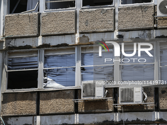 A view of a damaged building in the area of an explosion as Israeli policemen are searching the scene in Tel Aviv, Israel, on July 19, 2024....