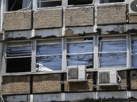 A view of a damaged building in the area of an explosion as Israeli policemen are searching the scene in Tel Aviv, Israel, on July 19, 2024....