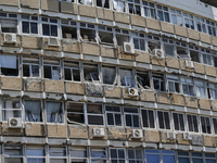 A view of a damaged building in the area of an explosion as Israeli policemen are searching the scene in Tel Aviv, Israel, on July 19, 2024....