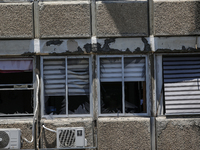 A view of a damaged building in the area of an explosion as Israeli policemen are searching the scene in Tel Aviv, Israel, on July 19, 2024....