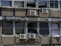 A view of a damaged building in the area of an explosion as Israeli policemen are searching the scene in Tel Aviv, Israel, on July 19, 2024....