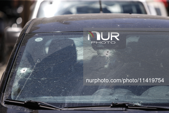 A view of a damaged building in the area of an explosion as Israeli policemen are searching the scene in Tel Aviv, Israel, on July 19, 2024....