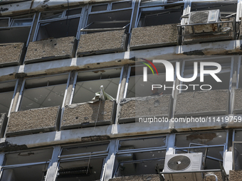 A view of a damaged building in the area of an explosion as Israeli policemen are searching the scene in Tel Aviv, Israel, on July 19, 2024....