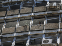 A view of a damaged building in the area of an explosion as Israeli policemen are searching the scene in Tel Aviv, Israel, on July 19, 2024....