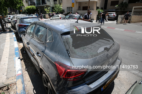 A view of a damaged building in the area of an explosion as Israeli policemen are searching the scene in Tel Aviv, Israel, on July 19, 2024....