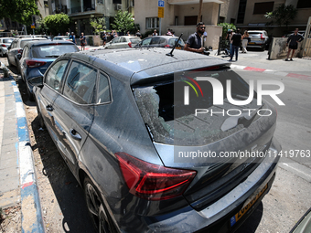 A view of a damaged building in the area of an explosion as Israeli policemen are searching the scene in Tel Aviv, Israel, on July 19, 2024....