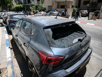 A view of a damaged building in the area of an explosion as Israeli policemen are searching the scene in Tel Aviv, Israel, on July 19, 2024....