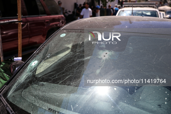 A view of a damaged building in the area of an explosion as Israeli policemen are searching the scene in Tel Aviv, Israel, on July 19, 2024....