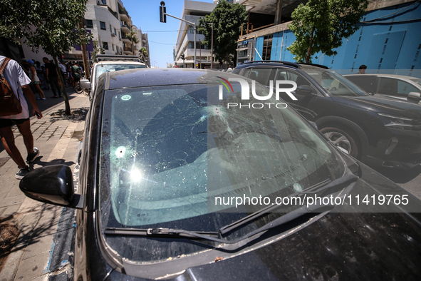 A view of a damaged building in the area of an explosion as Israeli policemen are searching the scene in Tel Aviv, Israel, on July 19, 2024....