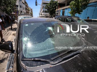 A view of a damaged building in the area of an explosion as Israeli policemen are searching the scene in Tel Aviv, Israel, on July 19, 2024....