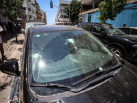 A view of a damaged building in the area of an explosion as Israeli policemen are searching the scene in Tel Aviv, Israel, on July 19, 2024....