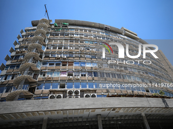 A view of a damaged building in the area of an explosion as Israeli policemen are searching the scene in Tel Aviv, Israel, on July 19, 2024....