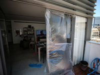 A view of a damaged building in the area of an explosion as Israeli policemen are searching the scene in Tel Aviv, Israel, on July 19, 2024....