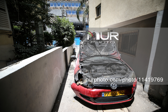 A view of a damaged building in the area of an explosion as Israeli policemen are searching the scene in Tel Aviv, Israel, on July 19, 2024....