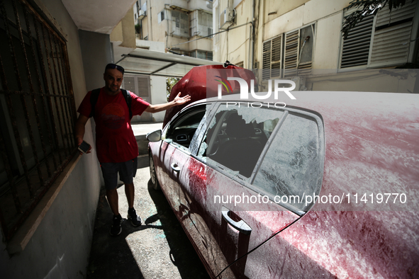 A view of a damaged building in the area of an explosion as Israeli policemen are searching the scene in Tel Aviv, Israel, on July 19, 2024....