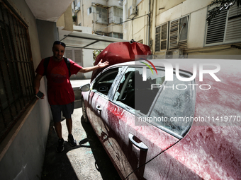 A view of a damaged building in the area of an explosion as Israeli policemen are searching the scene in Tel Aviv, Israel, on July 19, 2024....