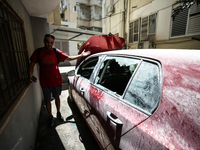 A view of a damaged building in the area of an explosion as Israeli policemen are searching the scene in Tel Aviv, Israel, on July 19, 2024....