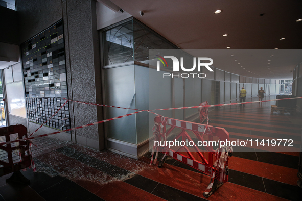 A view of a damaged building in the area of an explosion as Israeli policemen are searching the scene in Tel Aviv, Israel, on July 19, 2024....