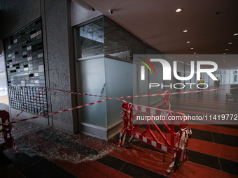 A view of a damaged building in the area of an explosion as Israeli policemen are searching the scene in Tel Aviv, Israel, on July 19, 2024....