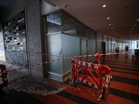 A view of a damaged building in the area of an explosion as Israeli policemen are searching the scene in Tel Aviv, Israel, on July 19, 2024....