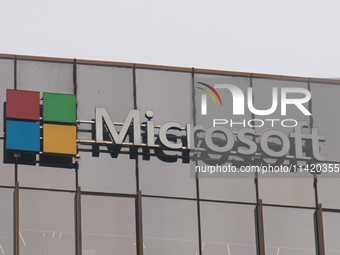 A signage of Microsoft is being seen outside its office building in Gurugram, in the outskirts of New Delhi, India, on July 19, 2024. Airlin...