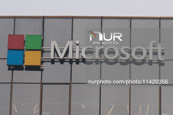 A signage of Microsoft is being seen outside its office building in Gurugram, in the outskirts of New Delhi, India, on July 19, 2024. Airlin...