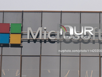 A signage of Microsoft is being seen outside its office building in Gurugram, in the outskirts of New Delhi, India, on July 19, 2024. Airlin...