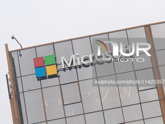 A signage of Microsoft is being seen outside its office building in Gurugram, in the outskirts of New Delhi, India, on July 19, 2024. Airlin...