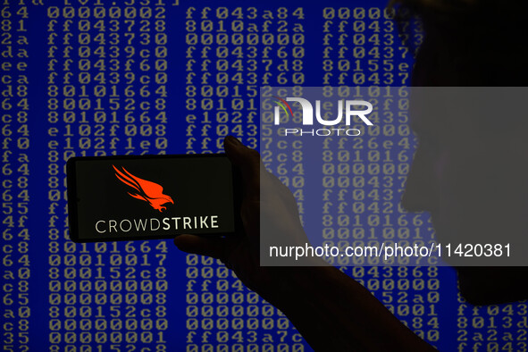 The CrowdStrike logo is being displayed on a smartphone in this photo illustration in Brussels, Belgium, on July 19, 2024. (Photo Illustrati...