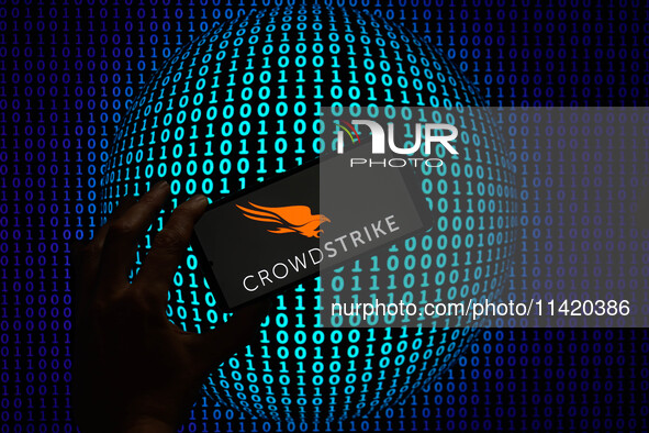 The CrowdStrike logo is being displayed on a smartphone in this photo illustration in Brussels, Belgium, on July 19, 2024. (Photo Illustrati...