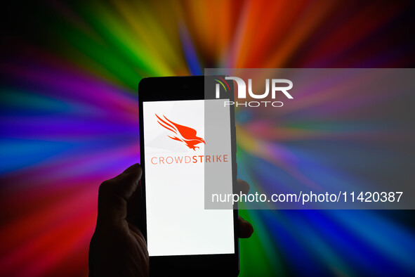 The CrowdStrike logo is being displayed on a smartphone in this photo illustration in Brussels, Belgium, on July 19, 2024. (Photo Illustrati...