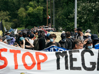 Protesters are marching during a demonstration against the construction of a giant water reservoir (mega-bassine) in Migne-Auxances, western...