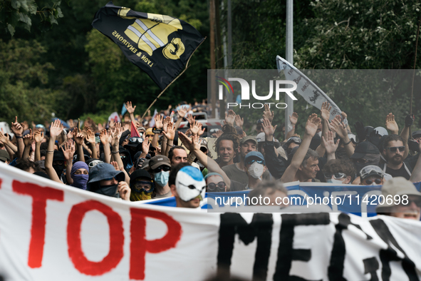 Protesters are marching during a demonstration against the construction of a giant water reservoir (mega-bassine) in Migne-Auxances, western...