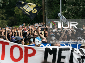 Protesters are marching during a demonstration against the construction of a giant water reservoir (mega-bassine) in Migne-Auxances, western...