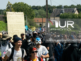 Protesters are marching during a demonstration against the construction of a giant water reservoir (mega-bassine) in Migne-Auxances, western...