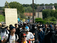 Protesters are marching during a demonstration against the construction of a giant water reservoir (mega-bassine) in Migne-Auxances, western...